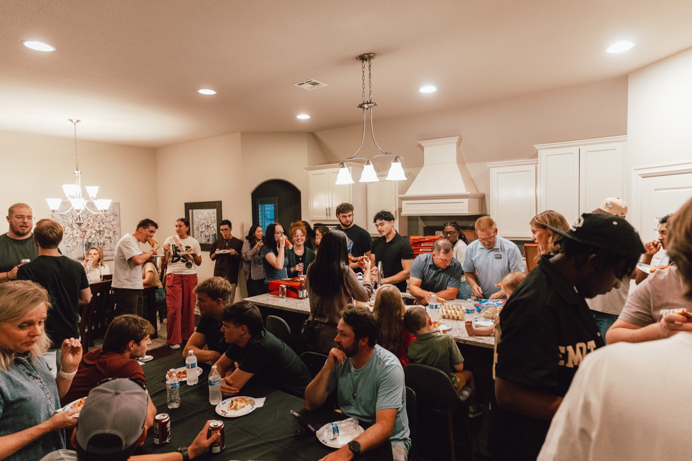 AYA community night with people gathered around food